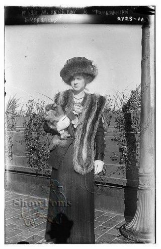 Marian Kennedy with her Pomeranian dog at the first specialty show held by the American Pomeranian Club